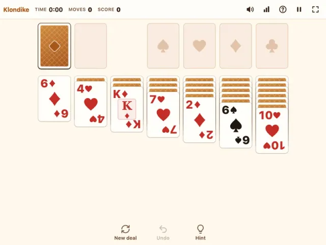 Solitaire Klondike table with seven tableau columns and four foundations on PlayToffee